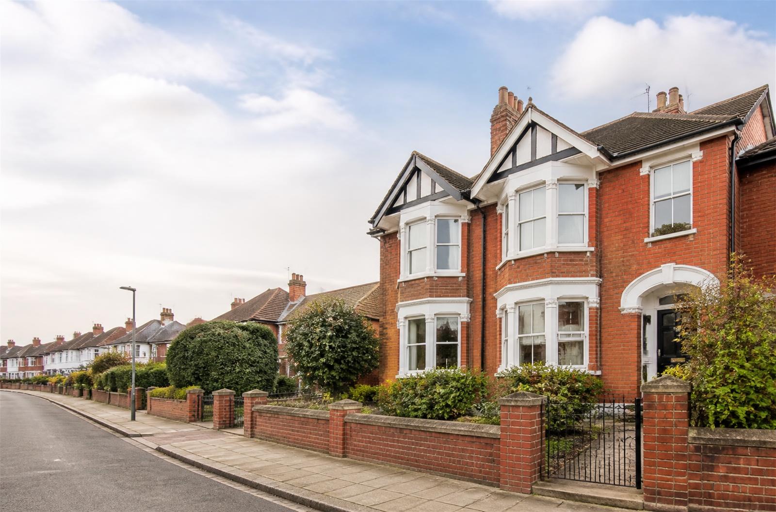 Red-brick homes on a residential street in the UK